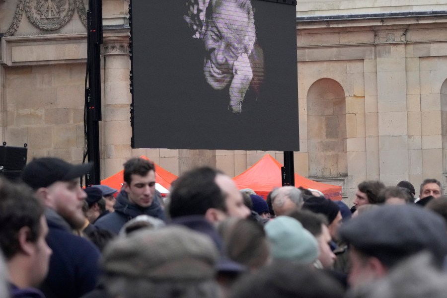 People wait outside Notre Dame du Val-de-Grace church before a public memorial for late far-right leader Jean-Marie Le Pen, Thursday, Jan. 16, 2025 in Paris. Jean-Marie Le Pen, the founder of France's main far-right party, died on Jan.7, 2025 aged 96. (AP Photo/Michel Euler)