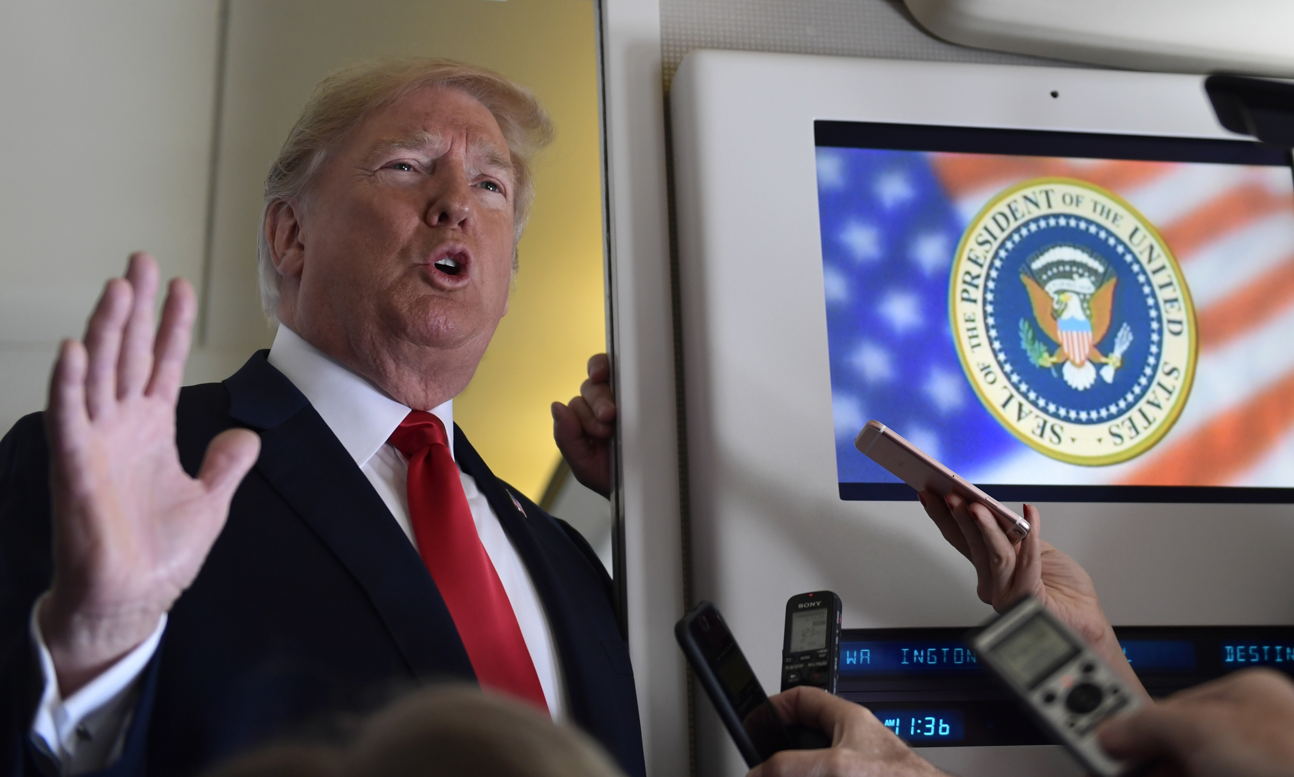 FILE - President Donald Trump talks to reporters while in flight from Billings, Mont., to Fargo, N.D., Sept. 7, 2018. (AP Photo/Susan Walsh, File)