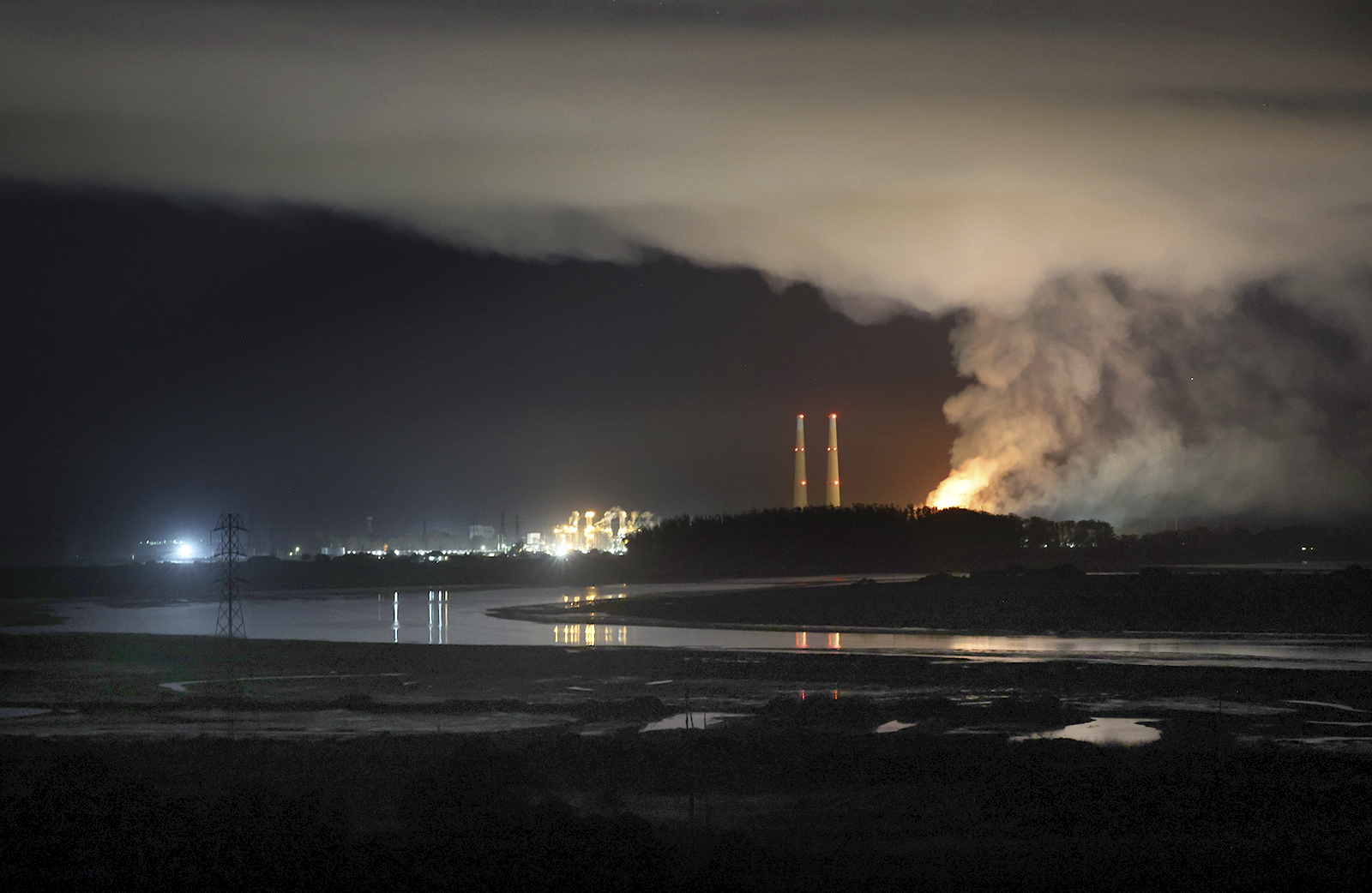 Flames and smoke from a fire fill the sky at the Moss Landing Power Plant Thursday Jan. 16, 2025 in Moss Landing, Calif. (Shmuel Thaler /The Santa Cruz Sentinel via AP)