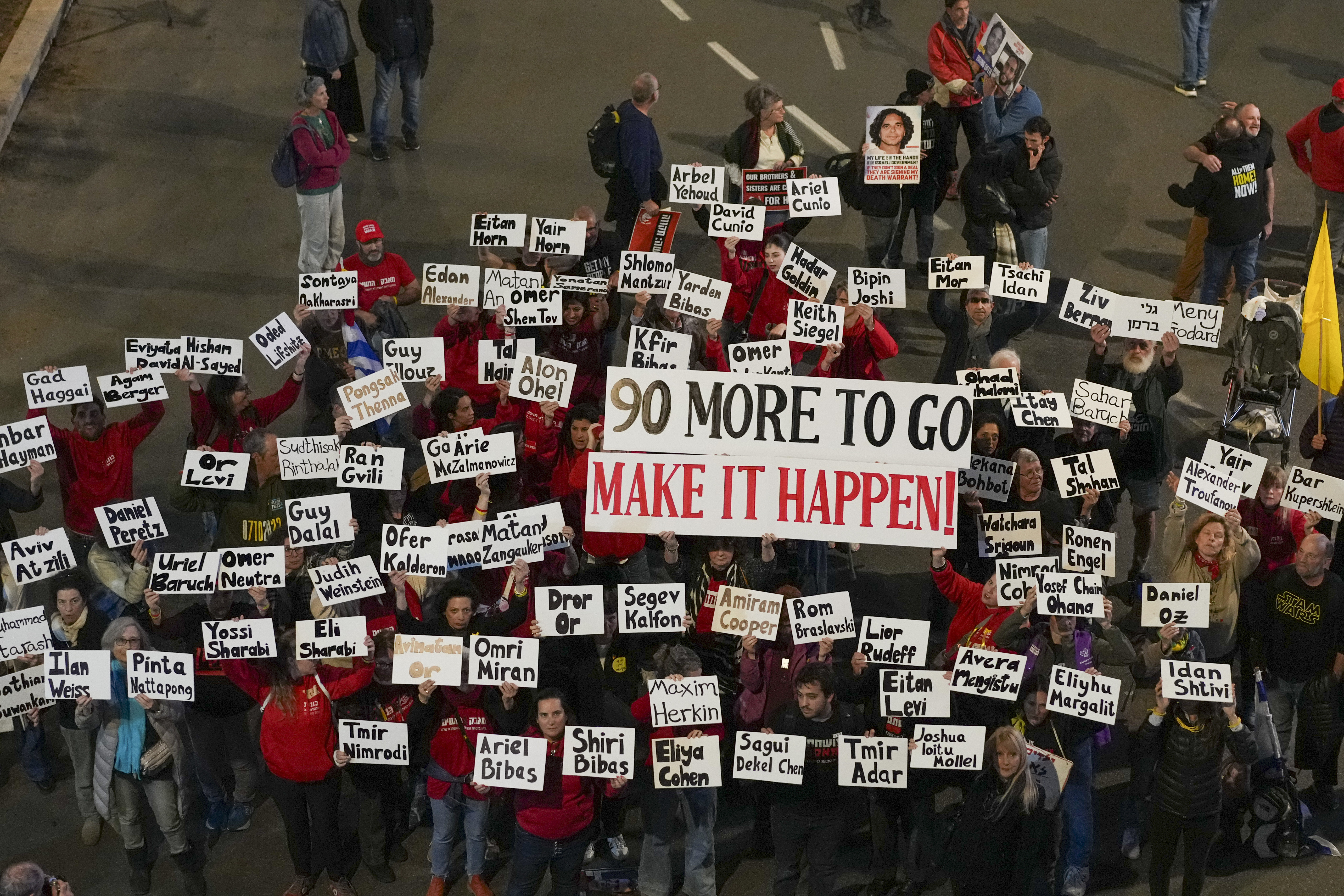 Demonstrators protest calling for the immediate release of the hostages held in the Gaza Strip by the Hamas militant group in Tel Aviv, Israel, Saturday, Jan. 25, 2025. (AP Photo/Ohad Zwigenberg)