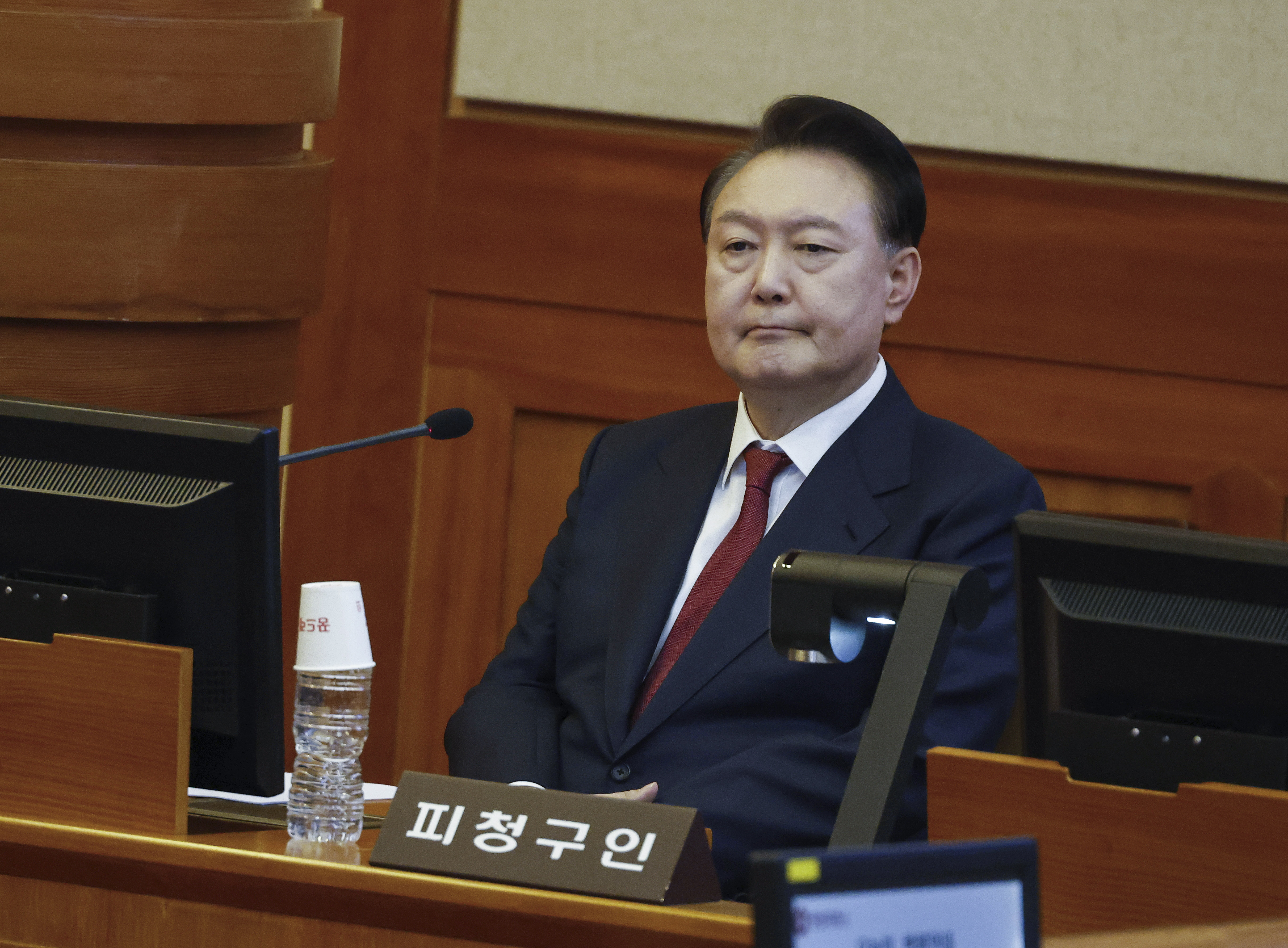 FILE- South Korea's impeached President Yoon Suk Yeol attends the fourth hearing of his impeachment trial over his short-lived imposition of martial law at the Constitutional Court in Seoul, South Korea, Thursday, Jan. 23, 2025. (Jeon Heon Kyun/Pool Photo via AP, File)