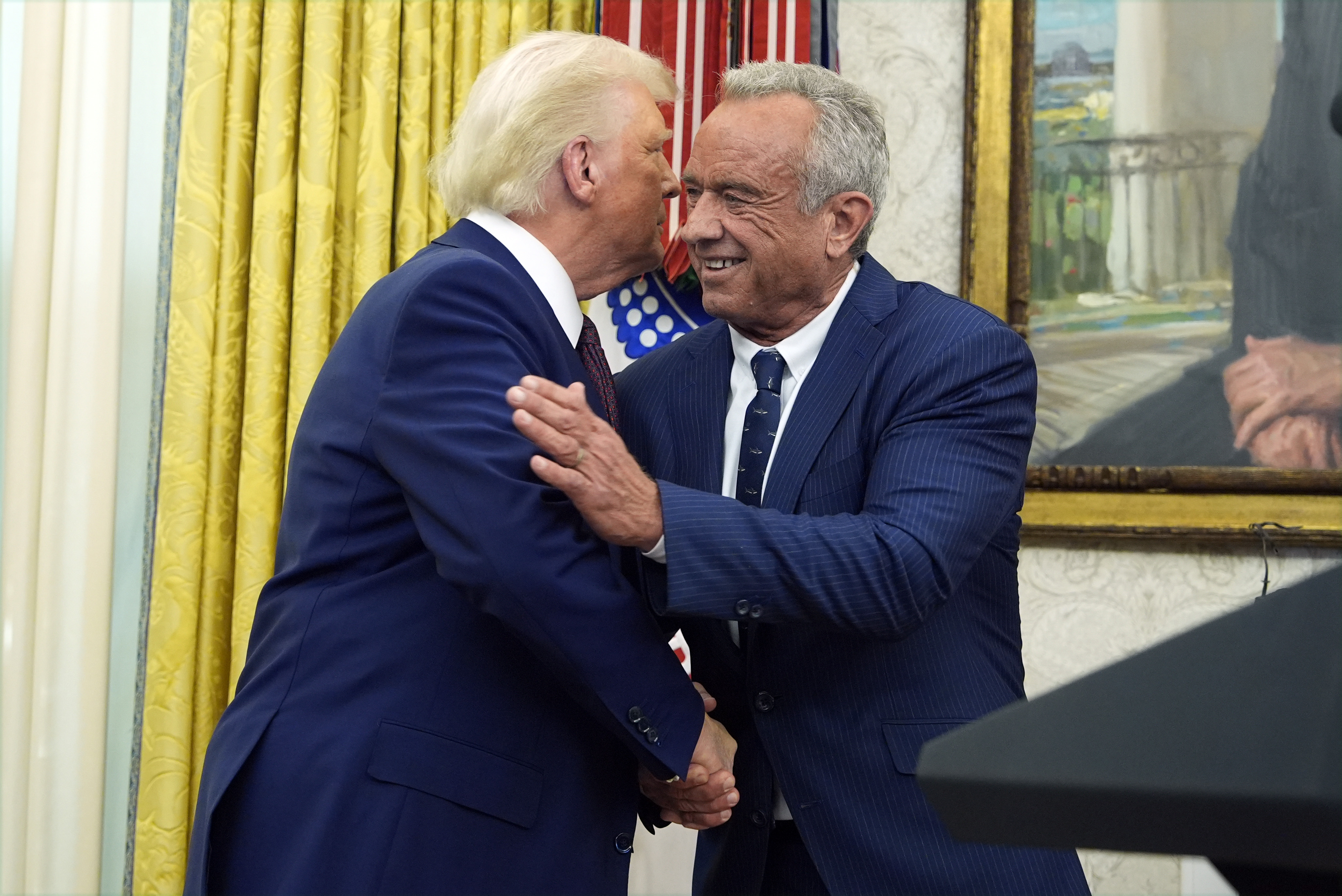 President Donald Trump congratulates Robert F. Kennedy Jr., after he was sworn in as Health and Human Services Secretary in the Oval Office at the White House, Thursday, Feb. 13, 2025, in Washington. (Photo/Alex Brandon)