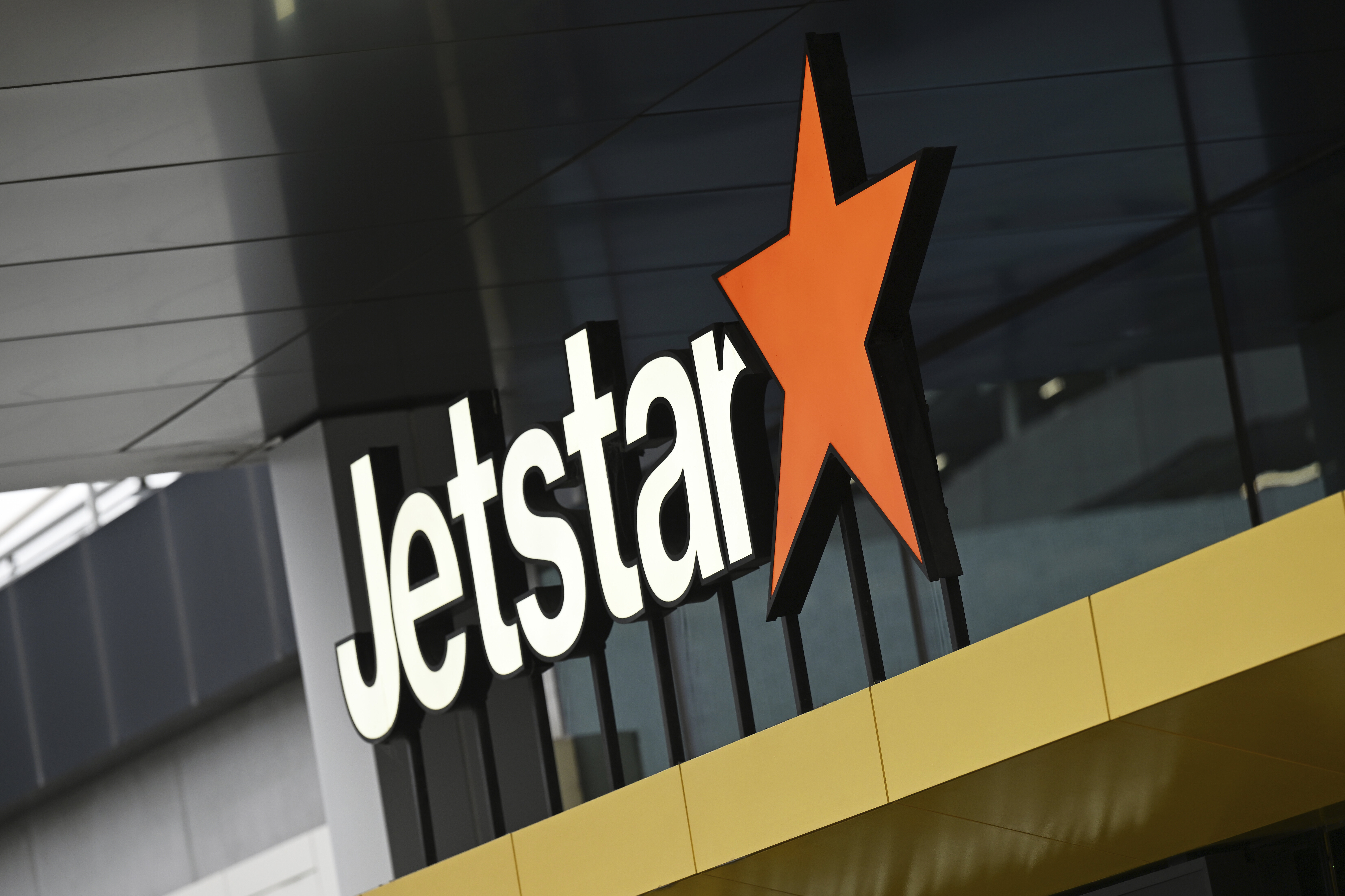 Signage for Australian airline, Jetstar, is pictured at Melbourne Airport, on July 20, 2024. (James Ross/AAP Image via AP)