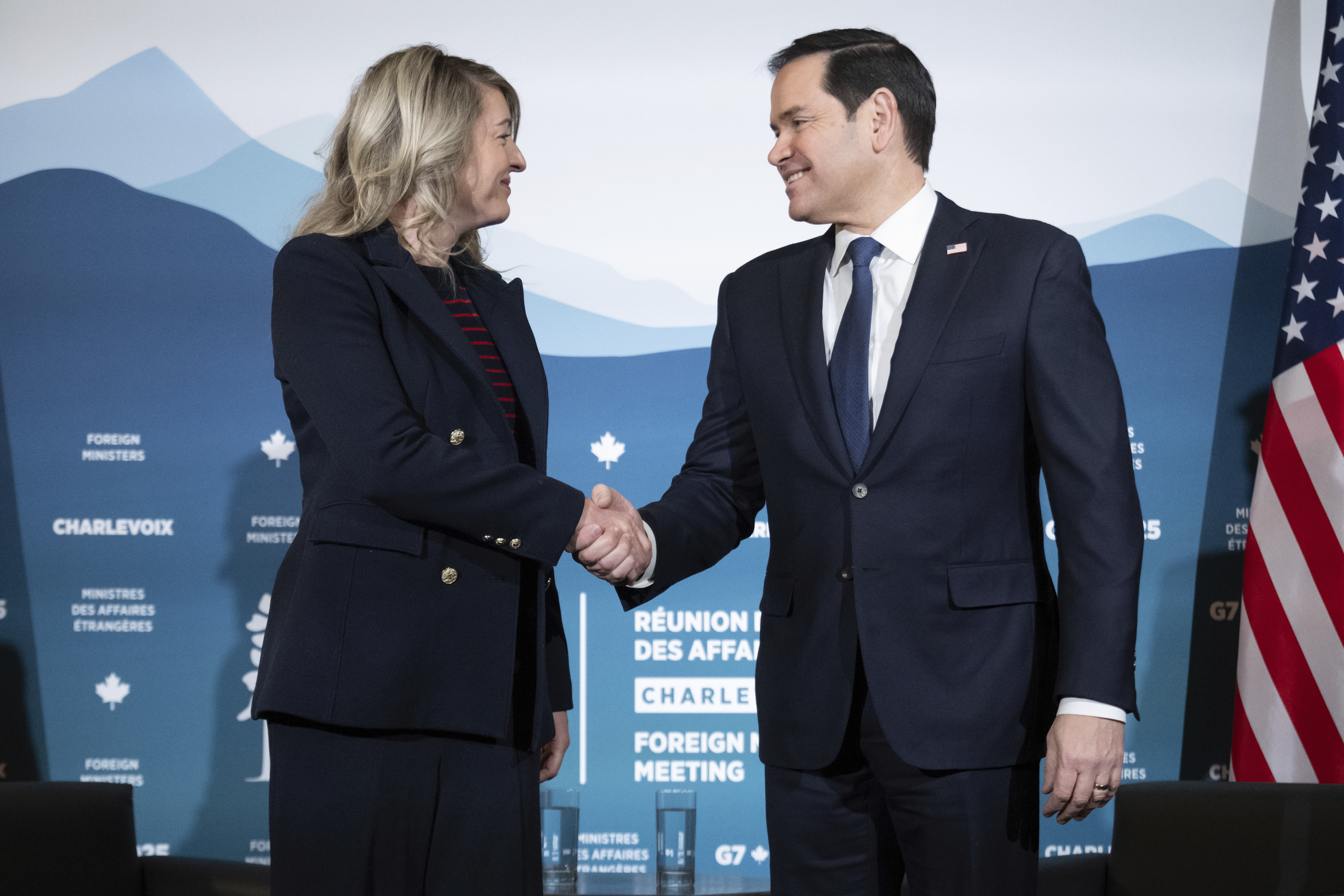 Canadian Foreign Minister Melanie Joly shakes hands with U.S. Secretary of State Marco Rubio during the G7 meeting of foreign ministers in Charlevoix, Quebec, Thursday, March 13, 2025. (Saul Loeb/Pool via AP)